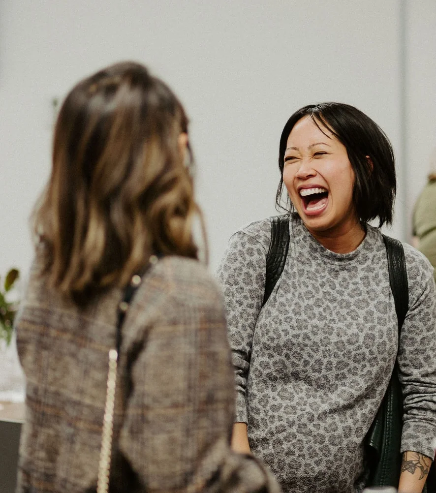Two people sharing a laugh in conversation