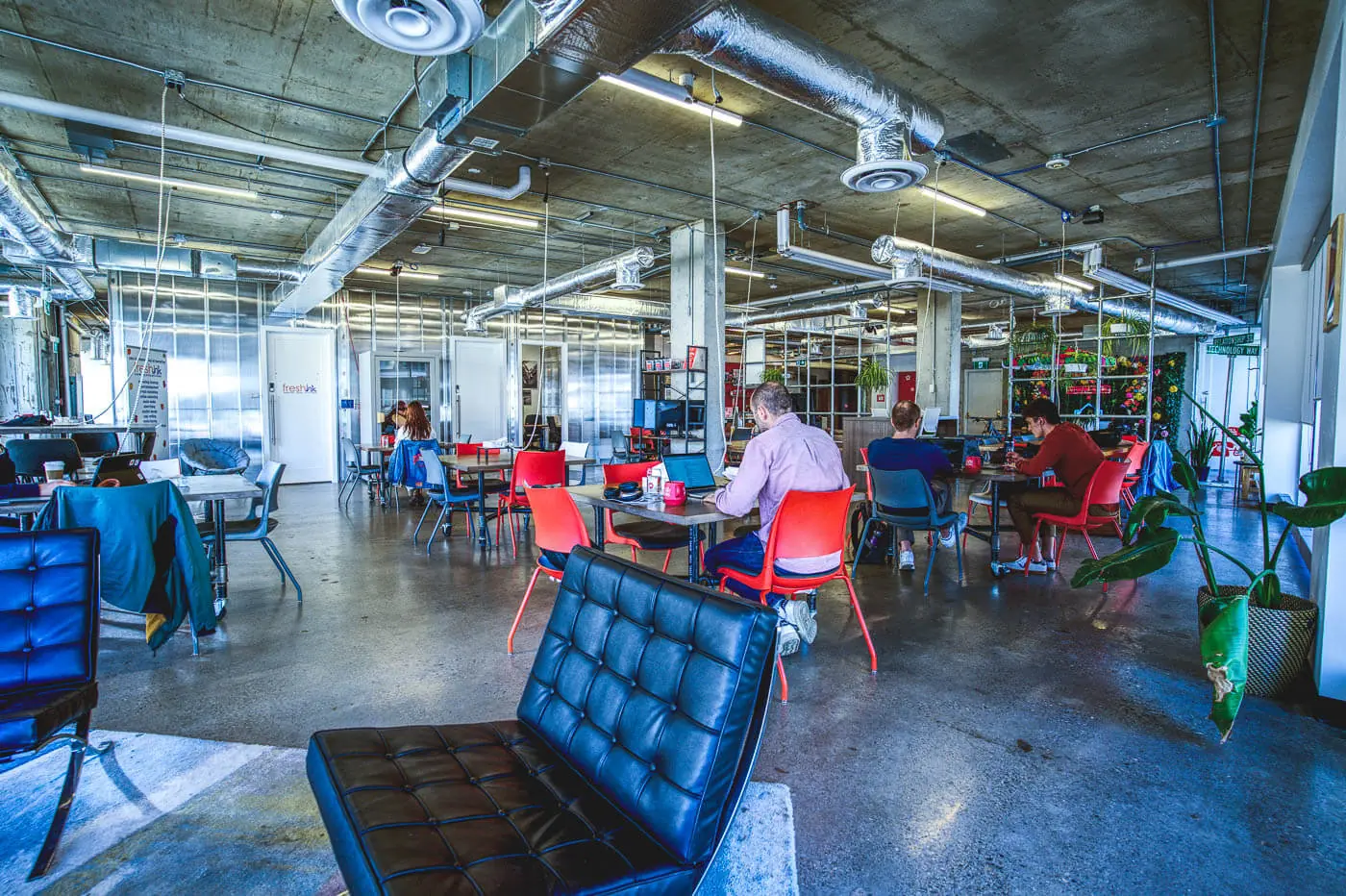 The broad shared floor inside Work Nicer Red Mile