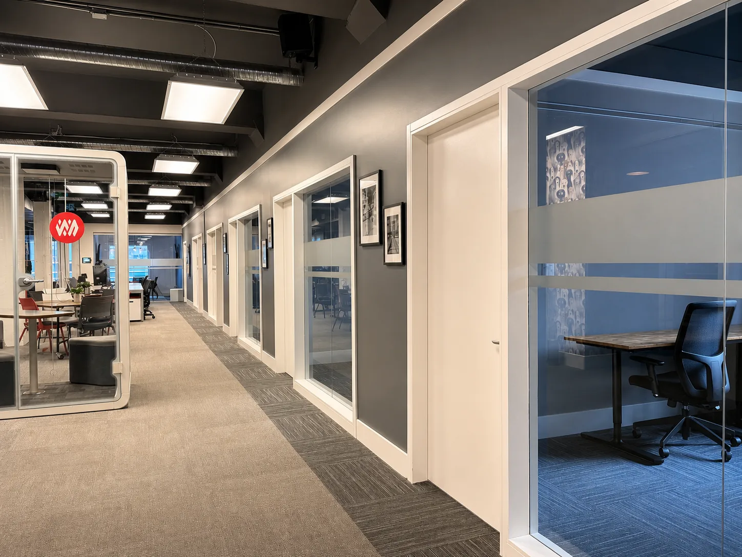 A corridor of glass-walled offices at Westcoast
