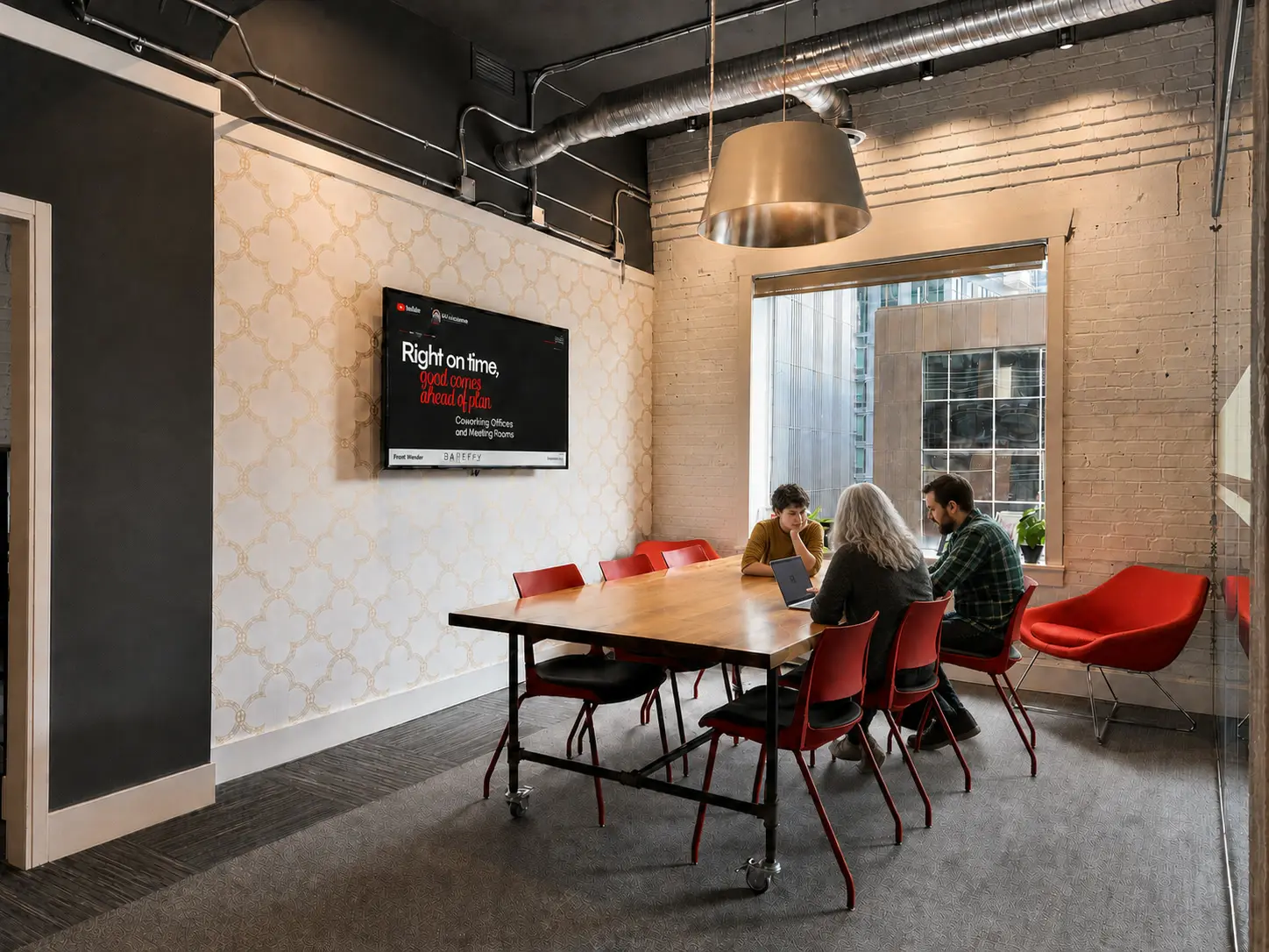 Members around a table in a meeting room at Westcoast
