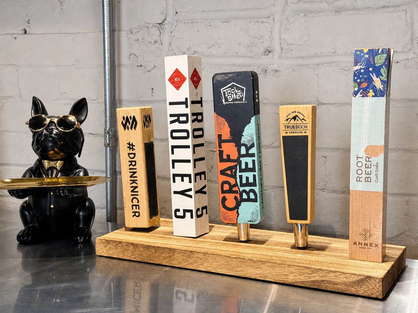 Beer taps on a wooden board at Westcoast